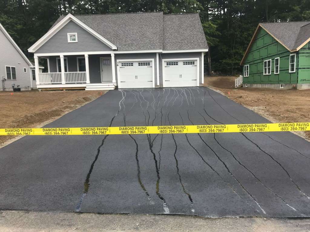 Diamond Paving driveway installation with new house in background