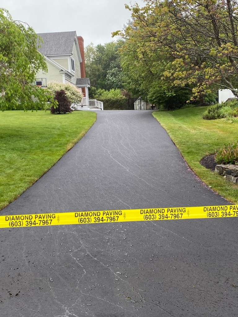 Diamond Paving contact information on driveway
