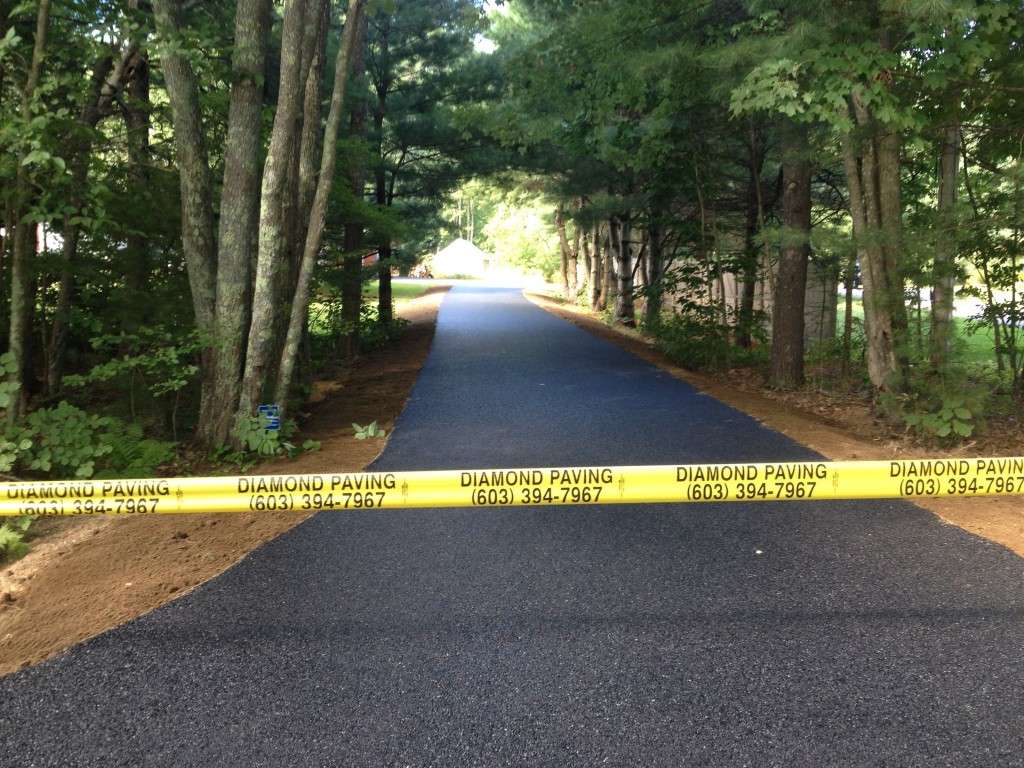 Asphalt driveway with Diamond Paving contact information
